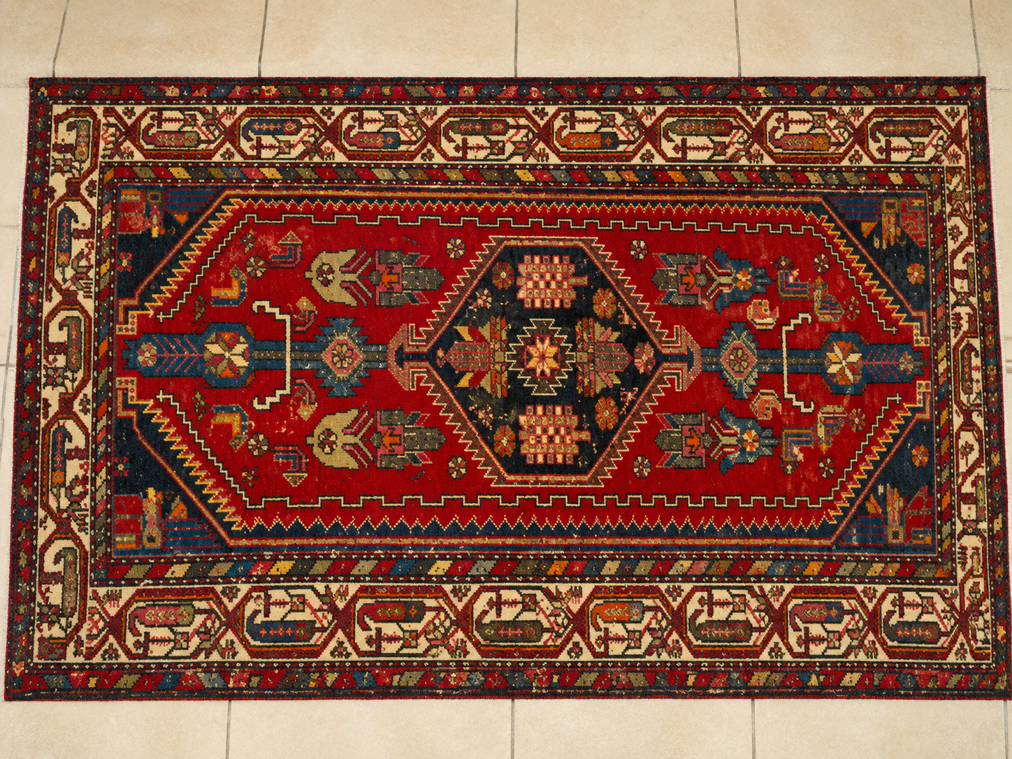 Full Persian carpet after restoration, showing the finished product